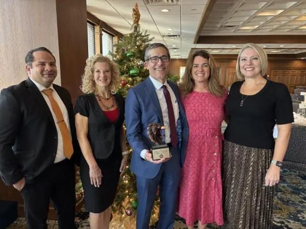 Michael P. Maddux P.A. legal team celebrating a professional award at a Tampa Bay recognition event.